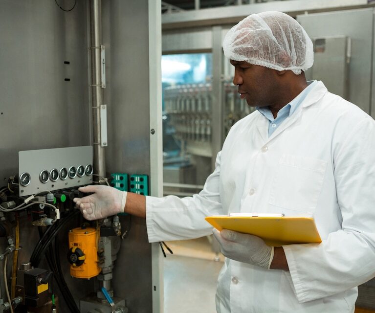 [fpdl.in]_confident-worker-operating-machine-juice-factory_107420-96520_large